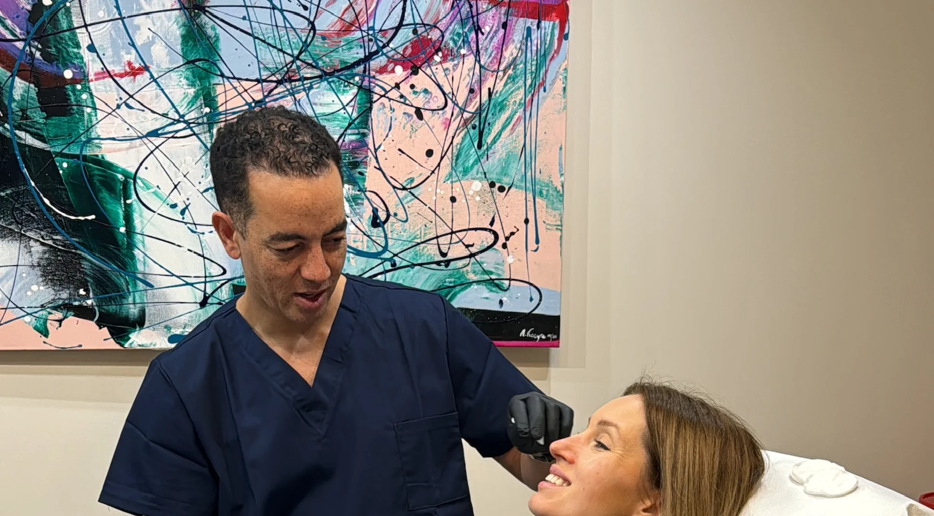 Dr Paul Munsanje treating a patient at Amara Clinic Dublin